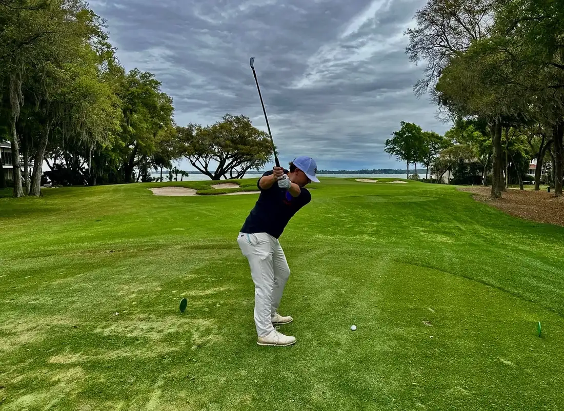 Will at the top of a golf backswing